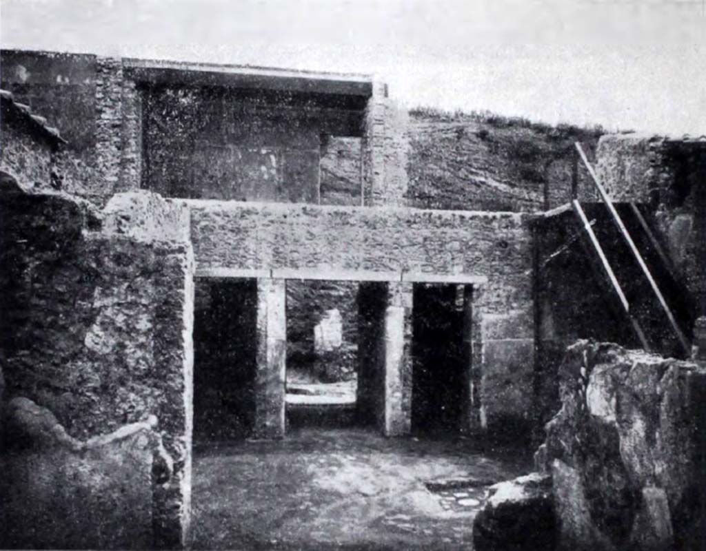 I.10.18 Pompeii. Looking east across atrium towards entrance doorway, in centre, between doorways to rooms 2 & 3.
On the right, is a reconstructed staircase on the south side of the atrium, leading up to the rooms of the upper floor.
See Notizie degli Scavi di Antichit, 1934, p. 342, fig.37.
