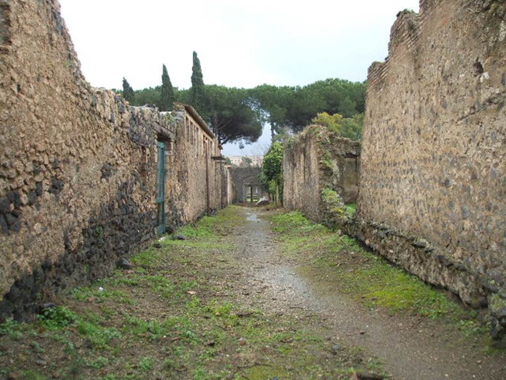 II.4.1 Pompeii. December 2006. Roadway looking south, with II.3.4, on right. 