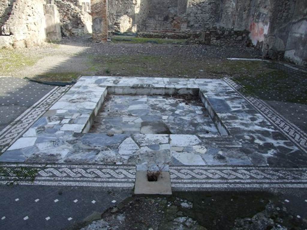 VI.1.7 Pompeii. December 2007. Impluvium in atrium, looking east.
According to Garcia y Garcia, this house was badly hit by the bombing on the terrible night between the 14th and15th September 1943, above all in the north-east section with the entrance at number 25. It also suffered the destruction of the atrium and part of its mosaic floor, and the total destruction of the tablinum and two rooms on its north side.
Fallen and partially lost was the wall of the west portico, decorated with splendid motifs of the IVth Style. Entering the house at number 25, the stairs to the right (north side) and a good part of the north wall of the atrium has now disappeared.
See Garcia y Garcia, L., 2006. Danni di guerra a Pompei. Rome: L’Erma di Bretschneider. (p.66)
