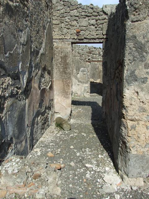 IX.2.18 Pompeii. March 2009. Room 11, garden area.  East portico with remains of steps to upper floor against north wall.  Looking east into room 13, corridor to atrium.
