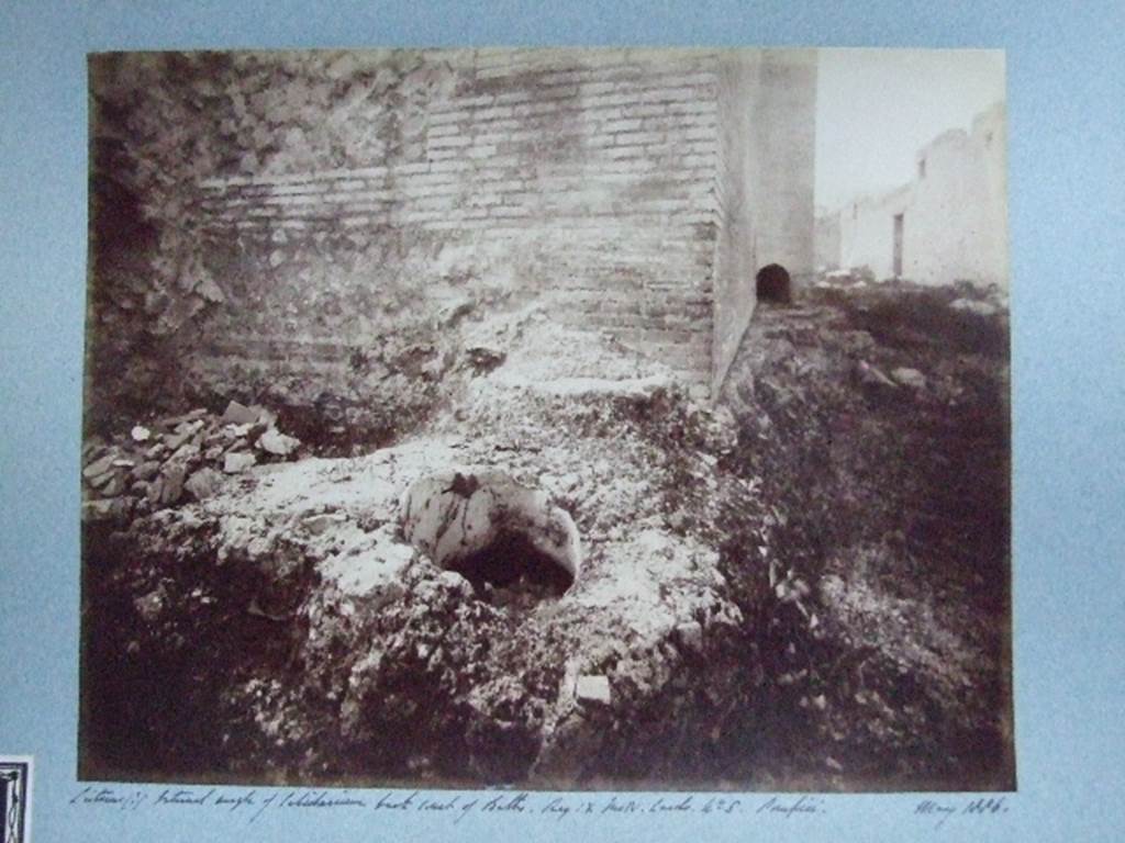 IX.4.15 Pompeii. May 1886. Cistern (?) at external angle of caldarium, back court of Baths.. 
Courtesy of Society of Antiquaries. Fox Collection.
This photograph is looking north along the east wall of calidarium s along baths area t.
The small arch in the base of the projecting tepidarium q wall can be seen.
The open area u and the doorway at IX.4.16 can be seen in the wall on the right.
