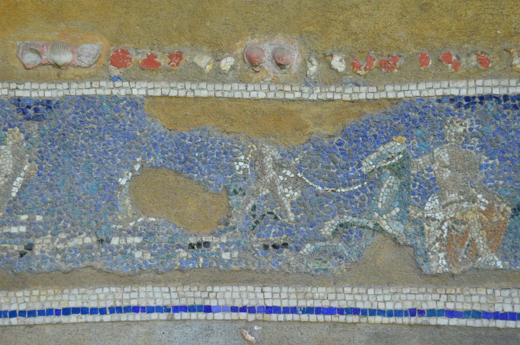 IX.7.20 Pompeii. December 2007. Mosaic fountain. Detail from arched top. 
Bathing scene with cherubs or cupids and male figure bathing and female figure holding robes.

