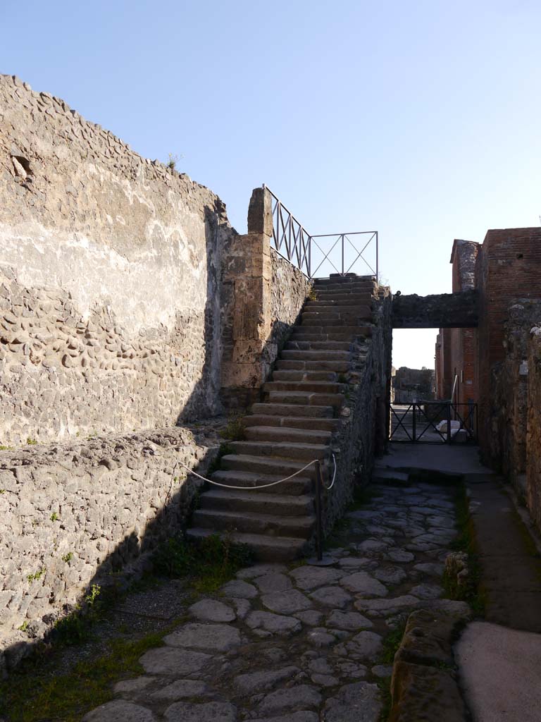 Vicolo di Championnet, Pompeii. March 2019. Stone steps at east end of roadway, between VIII.1 and VIII.2.
Foto Anne Kleineberg, ERC Grant 681269 DÉCOR.
