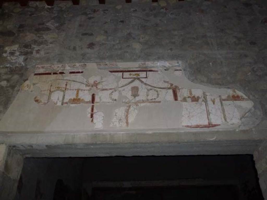 Oplontis, September 2011. Portico 24, detail of painted plaster above the doorway leading into room 23. Photo courtesy of Michael Binns.