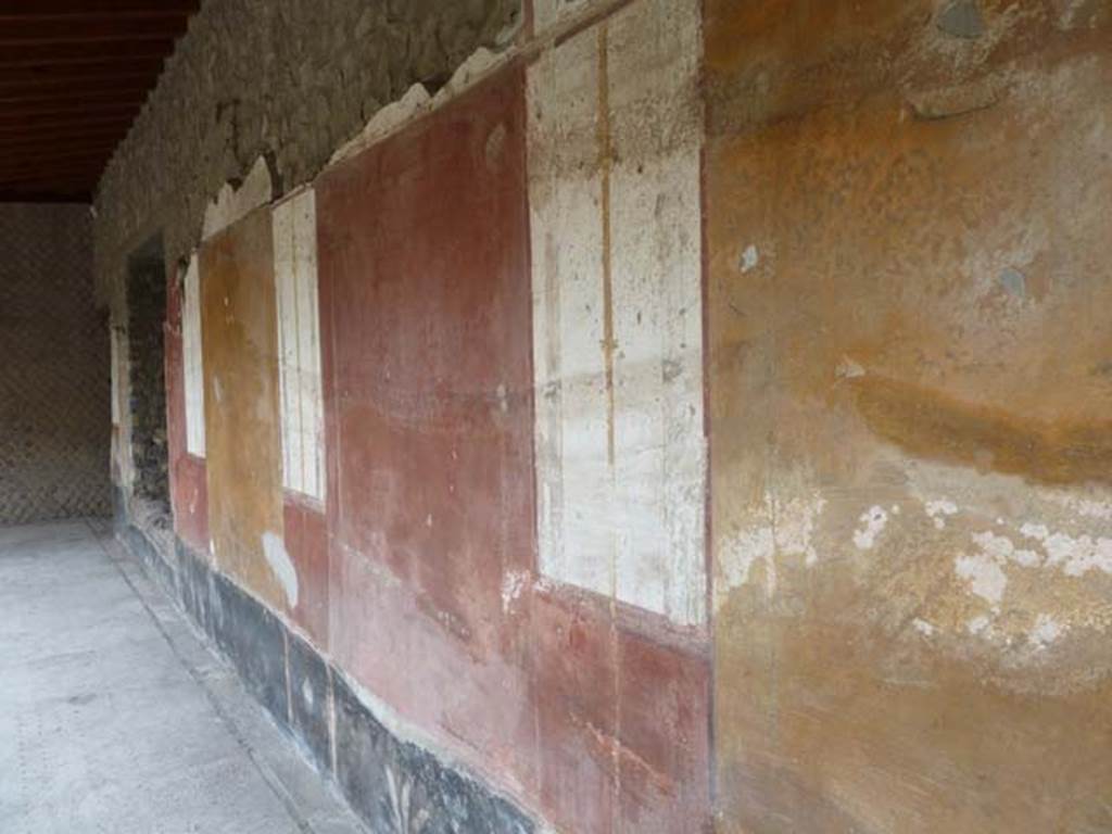 Oplontis, September 2015. Room 33, looking east along the painted wall of the west portico