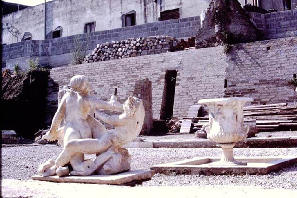 Oplontis Villa of Poppea, 1978. Terrace 92. Marble group of hermaphrodite and a faun, also recently discovered on the south side of the pool. 
Photo by Stanley A. Jashemski.   
Source: The Wilhelmina and Stanley A. Jashemski archive in the University of Maryland Library, Special Collections (See collection page) and made available under the Creative Commons Attribution-Non Commercial License v.4. See Licence and use details.
J78f0050
