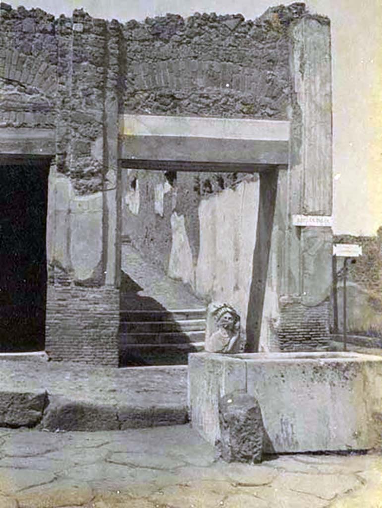 VII.9.67 Pompeii, 5th June 1925. 
Looking north on Via dellAbbondanza towards fountain and rear steps at VII.9.67. Photo courtesy of Rick Bauer.

