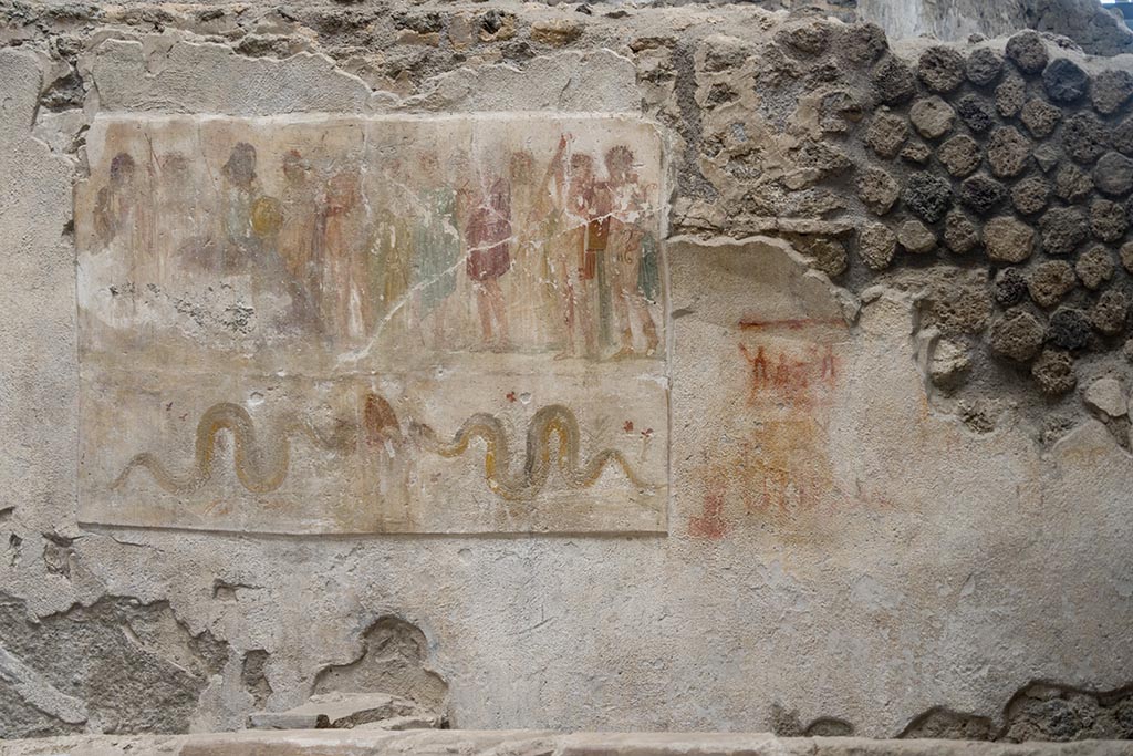 IX.12.6 Pompeii. July 2024. 
Room “n1”, west wall with lararium painting, on the right is the preparatory sketch. Photo courtesy of Johannes Eber.

