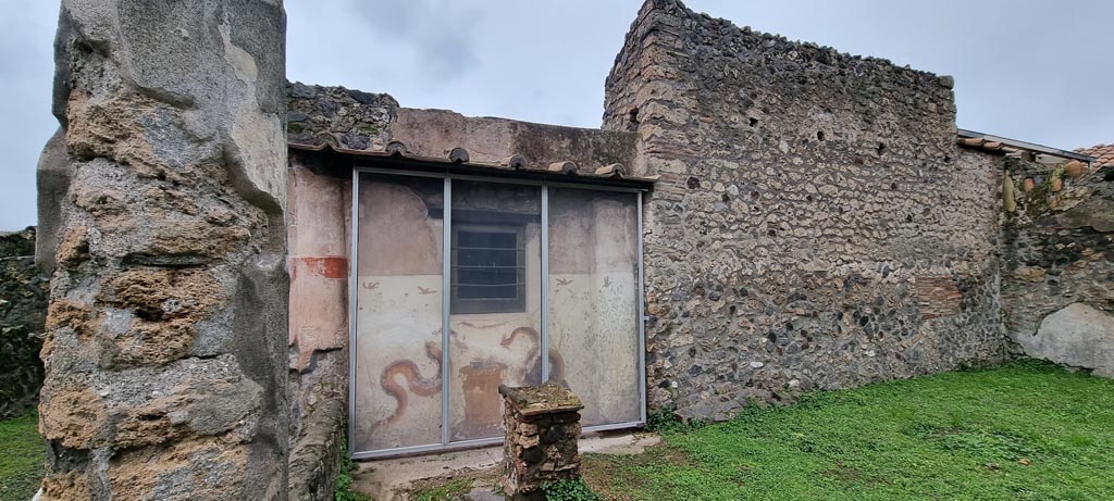 I.11.15 Pompeii. January 2023. 
Room 10, west wall of garden area with four-sided altar in front of painted lararium. Photo courtesy of Miriam Colomer.

