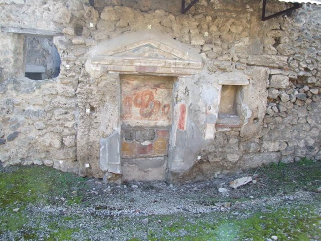 V.3.7 Pompeii. March 2009. West wall of the garden area. Aedicula lararium, with second niche.
Giacobello describes this as a pseudo-aedicula lararium.
See Giacobello, F., 2008. Larari Pompeiani: Iconografia e culto dei Lari in ambito domestico. Milano: LED Edizioni, (p.266 no.V37)


