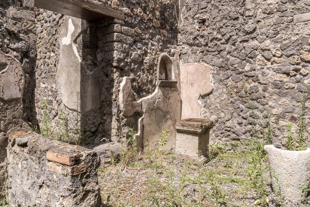 VI.7.23 Pompeii. July 2021. Looking towards east end of kitchen with lararium niche and altar. Photo courtesy of Johannes Eber.