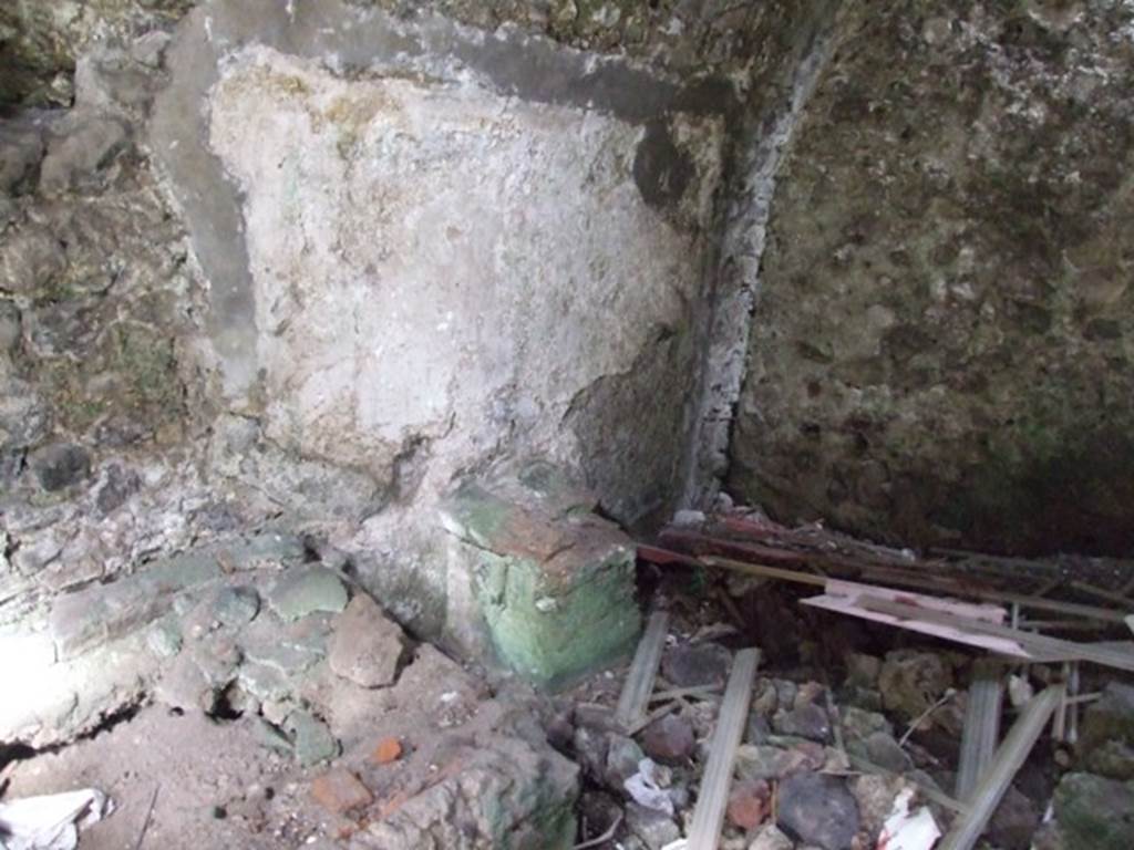 VI.9.10 Pompeii. March 2009. North wall of kitchen with remains of painted lararium and altar.