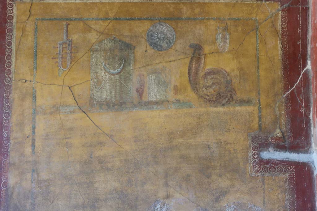 VI.16.7 Pompeii. December 2018. 
Room F, painting of objects of the cult of Isis, on east wall of lararium. Photo courtesy of Aude Durand.
