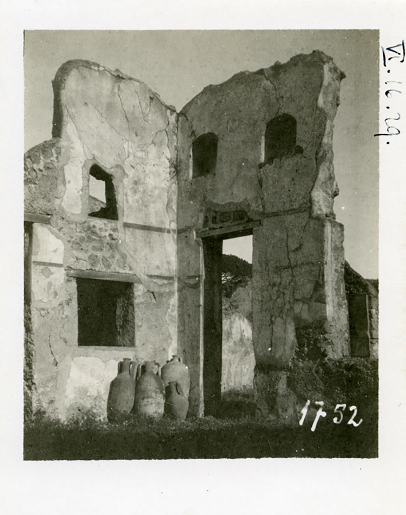 VI.16.29 Pompeii. Pre-1937-39. Looking north-east across atrium. 
Photo courtesy of American Academy in Rome, Photographic Archive. Warsher collection no. 1752.
On the left would have been the doorway to room G, oecus fenestratum.
In the south wall of room G would have been a window overlooking the atrium, and above that in the same wall was another small window.
In the east wall was a doorway into room H.

According to Giacobello, the doorway and wall on the east side of the atrium containing two niches collapsed following the 1980 earthquake.
Today, of the two arched niches only the one on the left has been partially conserved. 
They would have been a short distance away from each other and plastered inside in white stucco.
See Giacobello, F., 2008. Larari Pompeiani: Iconografia e culto dei Lari in ambito domestico. Milano: LED Edizioni. (p.243).
