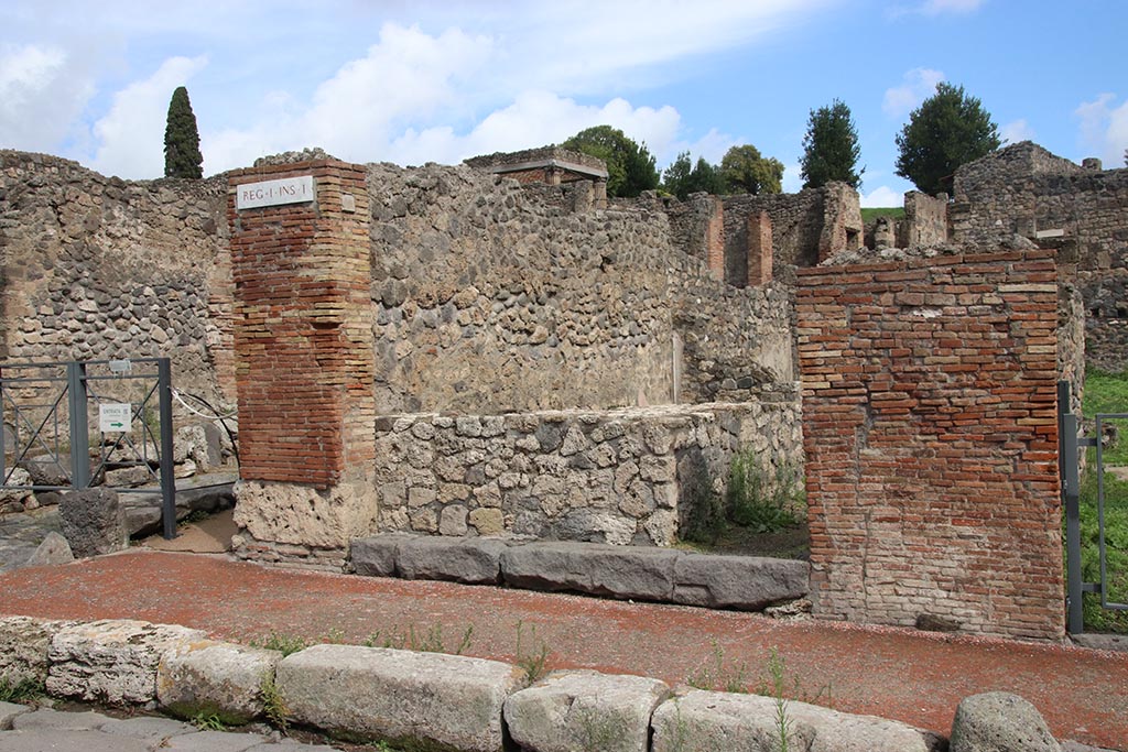 I.1.9 Pompeii. October 2024. Looking east on Via Stabiana towards entrance doorway. Photo courtesy of Klaus Heese.