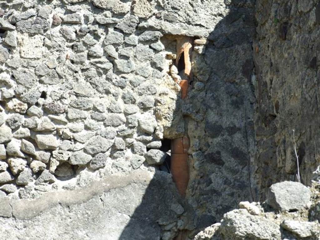 I.2.8 Pompeii.  March 2009.    Downpipe in south east corner of rear room.