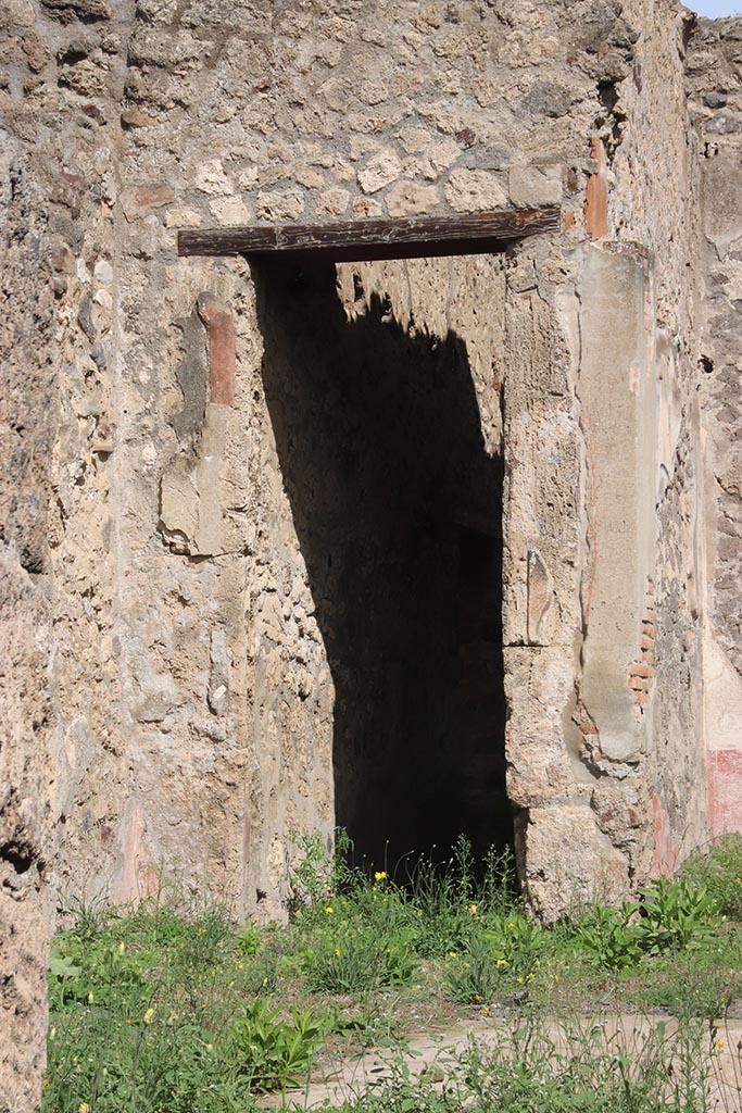 I.2.10 Pompeii. October 2024. 
Looking towards doorway in east wall, into corridor leading to rear. Photo courtesy of Klaus Heese.
