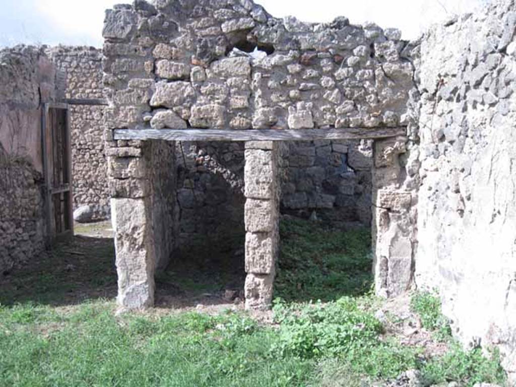 I.2.17 Pompeii. September 2010. Looking north to doorways to rooms 2 and 3 in north-east corner of atrium. Photo courtesy of Drew Baker.
