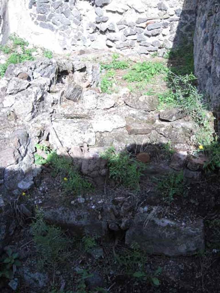 I.2.17 Pompeii. September 2010. Looking east at remains of stairs, on south side of doorway to room 11. Photo courtesy of Drew Baker.
