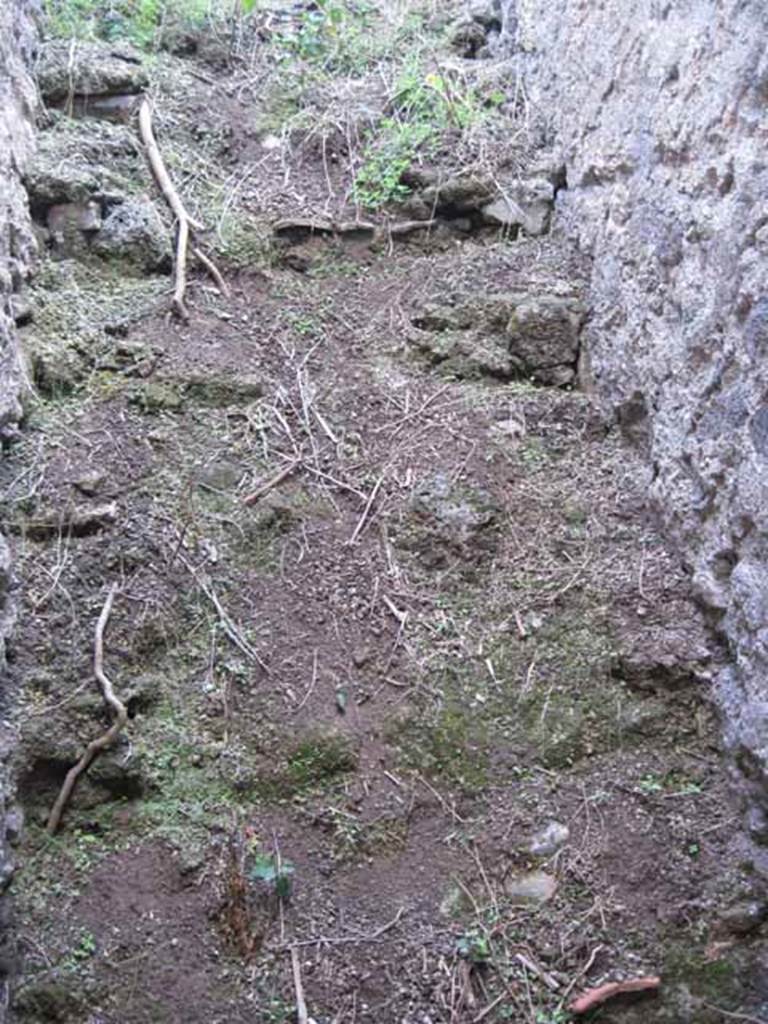 I.2.24 Pompeii. September 2010. Remains of stairs to upper floor, immediately to the west through the doorway. Photo courtesy of Drew Baker.
