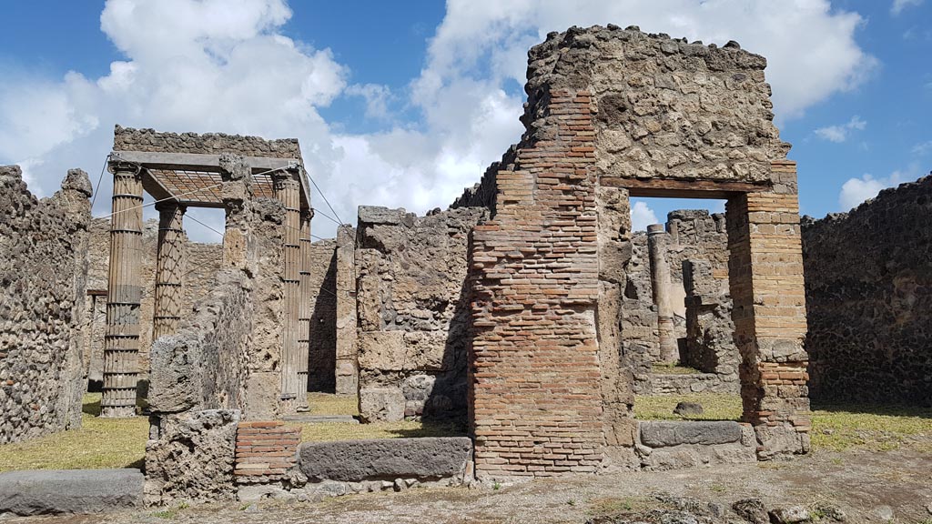 I.2.27 Pompeii. August 2023. 
Looking north across Vicolo del Conciapelle towards entrance doorway, in centre, with I.2.28 on left. Photo courtesy of Maribel Velasco.
