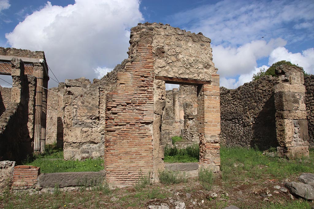 I.2.27 Pompeii, on left. October 2024. 
Looking north towards entrances 1.2.26 in centre, and I.2.25 on right. Photo courtesy of Klaus Heese.
