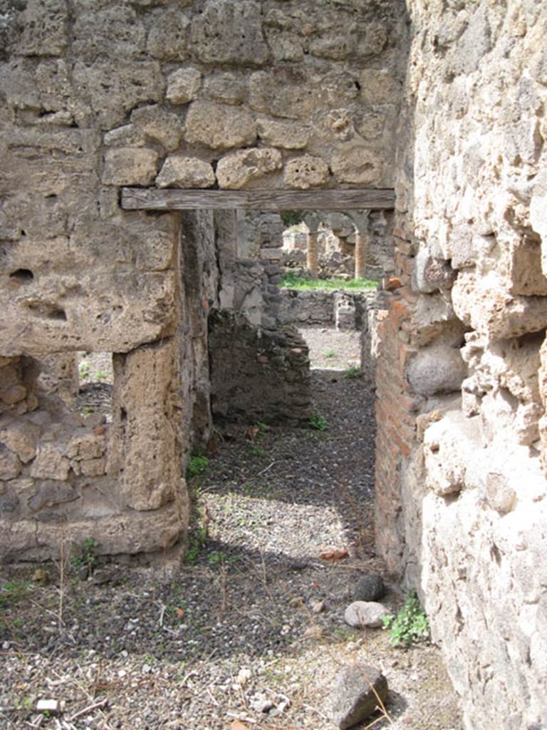 I.3.8b Pompeii. September 2010. Looking west through doorway from kitchen towards corridor. Photo courtesy of Drew Baker.
