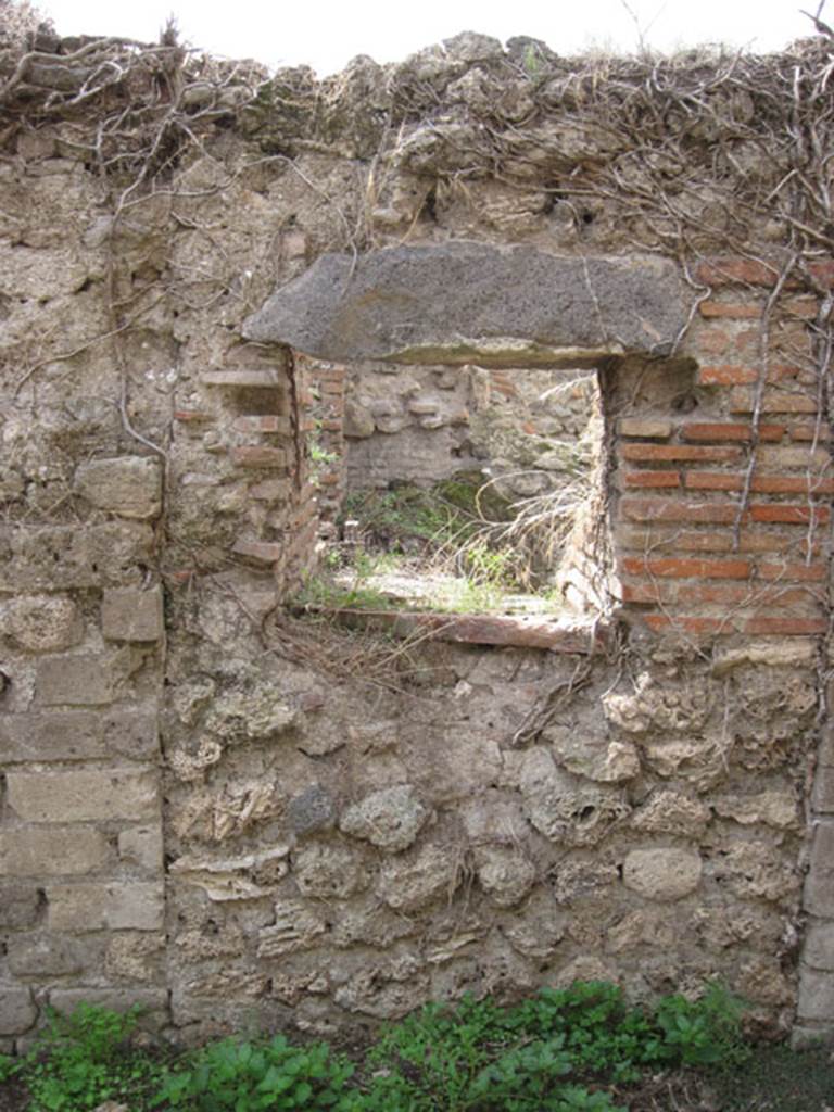 I.3.27 Pompeii. September 2010. Looking towards aperture into oven in west wall of room. 
Photo courtesy of Drew Baker.
