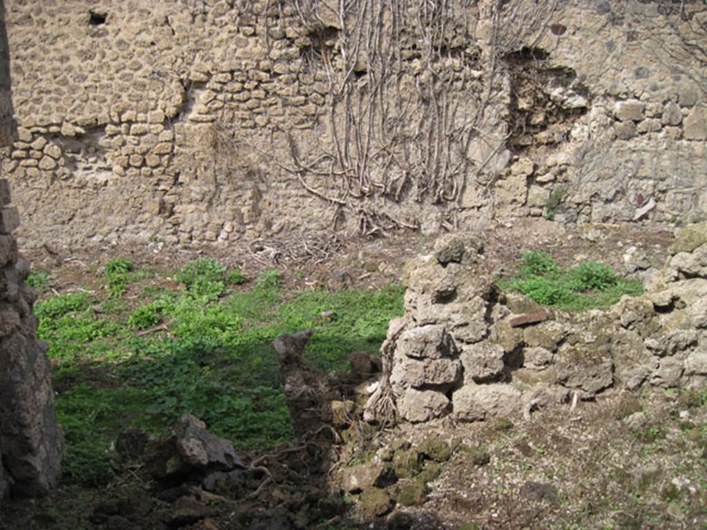 I.3.27 Pompeii. September 2010. Looking north from small room, through doorway into bakery room. Photo courtesy of Drew Baker.
