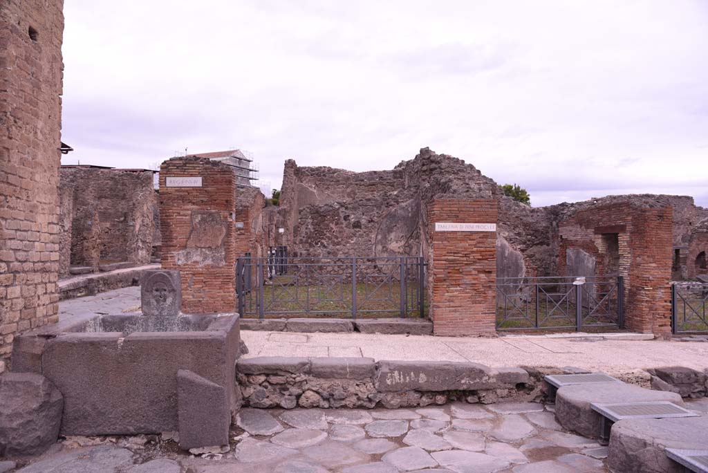 I.4.15 Pompeii. October 2019. Looking east towards entrance doorway at rear of fountain, with I.4.14, on right.
Foto Tobias Busen, ERC Grant 681269 DCOR.


