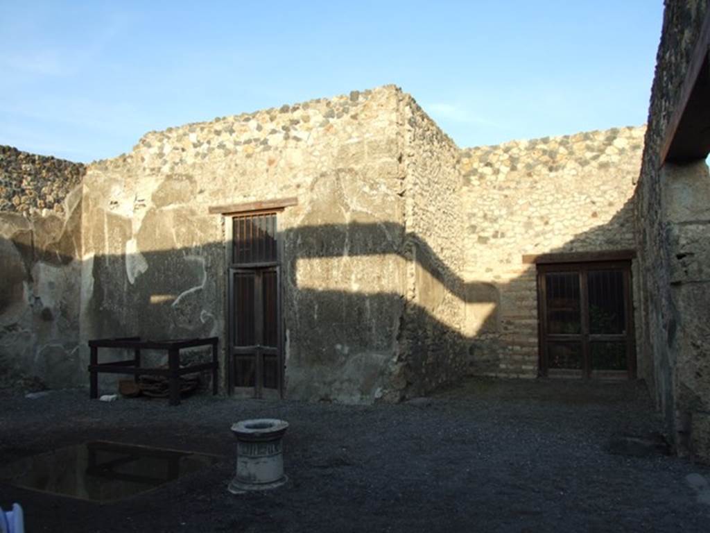 I.4.25 Pompeii. December 2007. 
Room 47, atrium. Looking east to doorway to room 53 on left, east ala 54, and doorway to room 55, on right.
