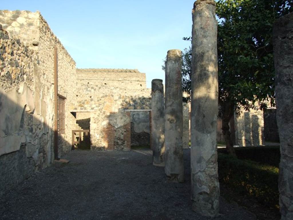 I.4.25 Pompeii. December 2007. Upper peristyle 56, looking east along north wall of upper peristyle, towards doorways to rooms 61 and 60.


