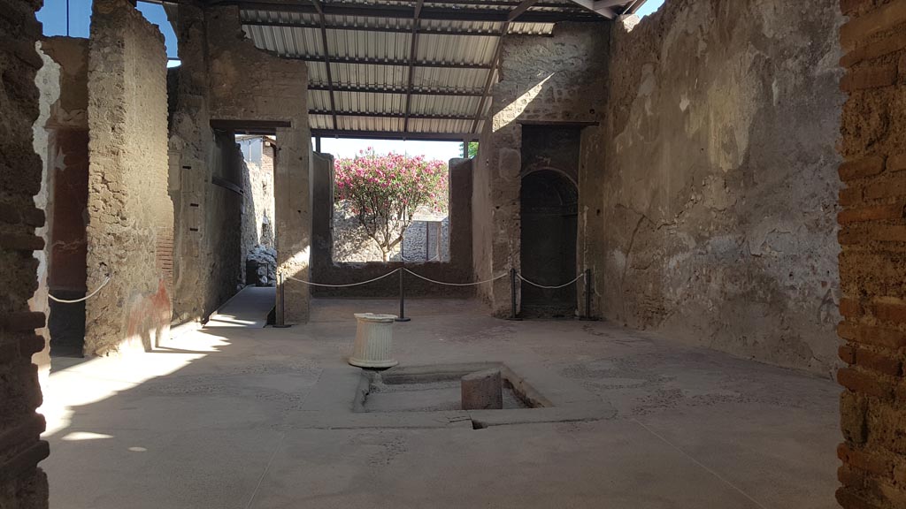 I.6.4 Pompeii. August 2023. Looking south across atrium from entrance corridor. Photo courtesy of Maribel Velasco.