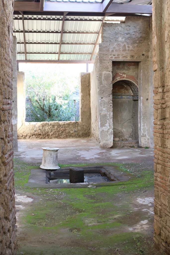 I.6.4 Pompeii. December 2018. 
Looking south across impluvium in atrium, from entrance corridor. 
The Lararium of Achilles, from which the house is named, is seen on the right.
Photo courtesy of Aude Durand.

