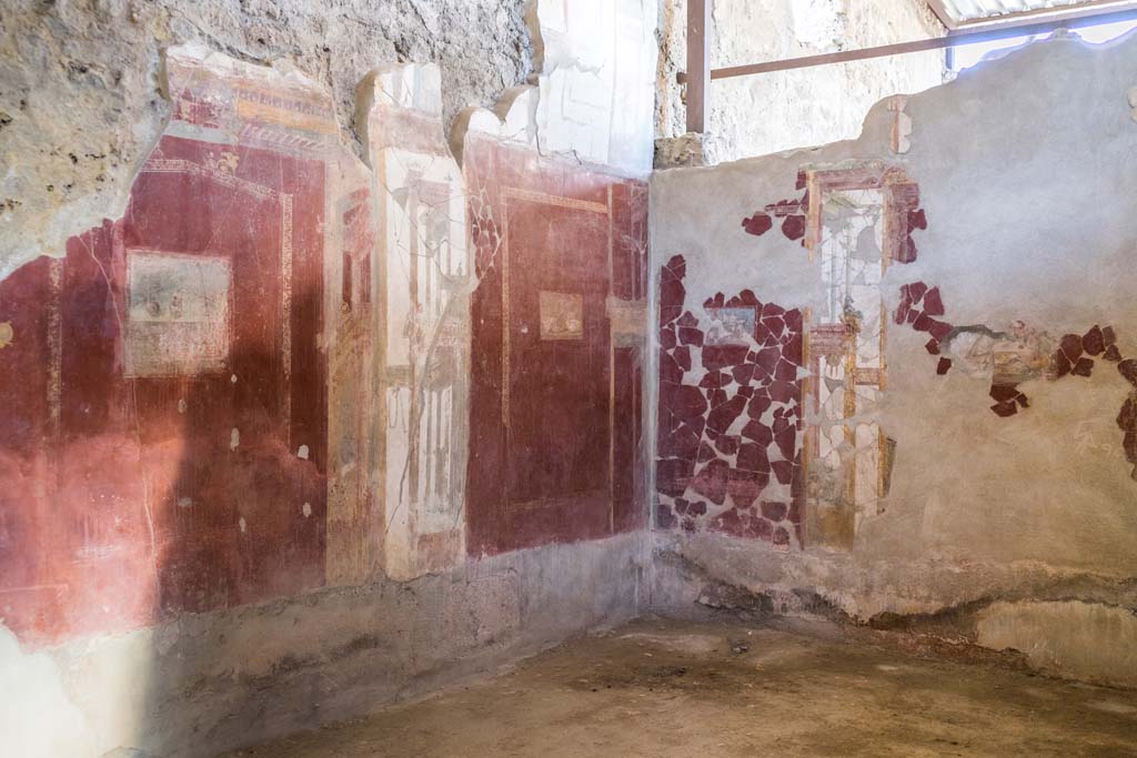 I.6.4 Pompeii. December 2021. 
Room 2, a triclinium, looking east along north wall, towards north-east corner. Photo courtesy of Johannes Eber.
In this room are paintings of a still life, of silver vases, a still life with figs, birds with fruit, and a maritime landscape.
