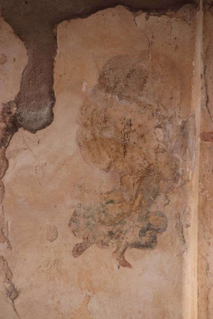 I.7.11 Pompeii. September 2021. 
Detail of figure from panel at east end of north wall of triclinium. Photo courtesy of Klaus Heese.
