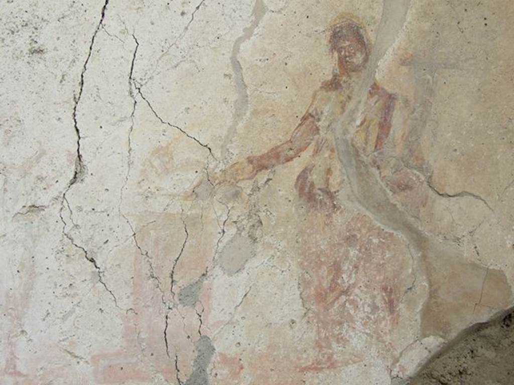 I.7.11 Pompeii. December 2006. Remains of sacrificial scene on Lararium on east side of atrium belonging to original house I.7.10. Between the Lares was an altar, and to the left of it were the tibicen and a young camillus. To the right of the altar stands the Genius, pouring a libation from a patera.
