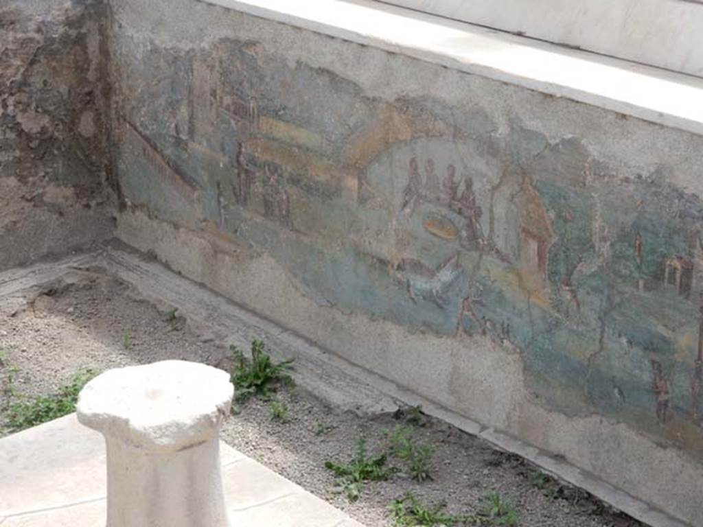 I.7.12 Pompeii. May 2017. Painted panel on inside of west side of summer triclinium at south end. Photo courtesy of Buzz Ferebee.

