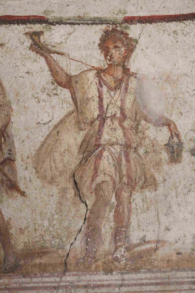 I.8.8 Pompeii. December 2018. Detail of painted figure of a Lar. Photo courtesy of Aude Durand.