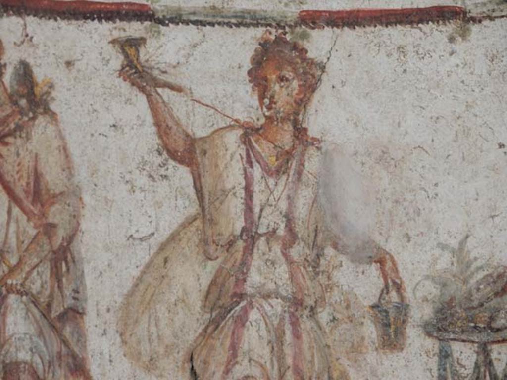 I.8.8 Pompeii. May 2015. Detail of painted figure of a Lar. Photo courtesy of Buzz Ferebee.

