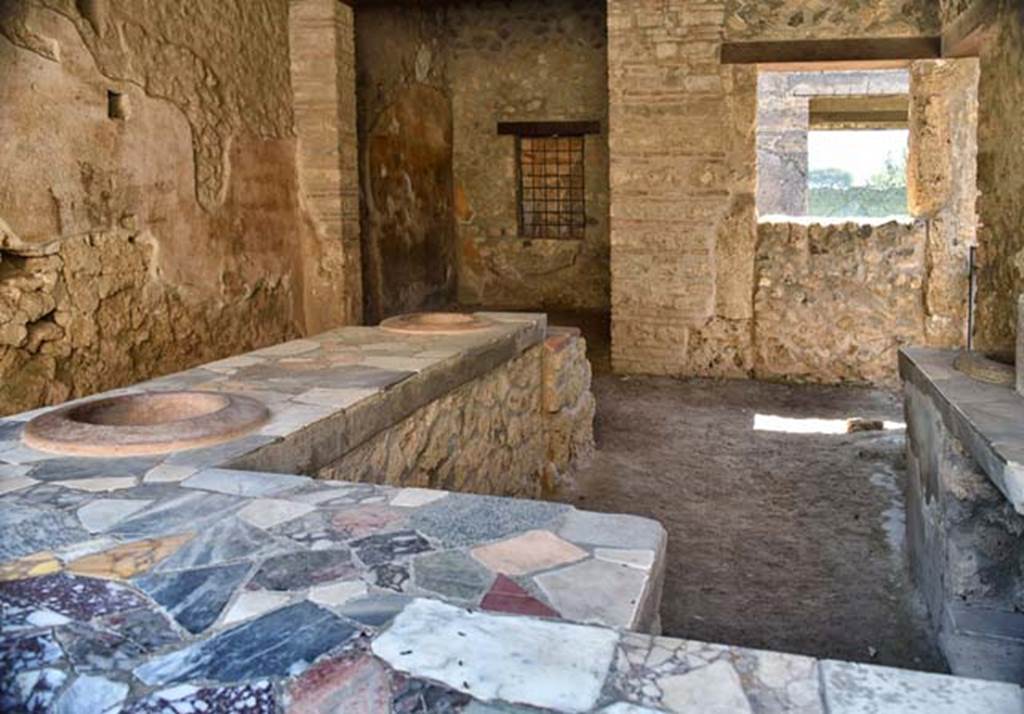 I.9.4 Pompeii. July 2021. Looking south-east across podium towards rear room. 
Foto Annette Haug, ERC Grant 681269 DÉCOR.
