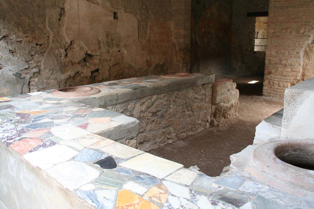 I.9.4 Pompeii. April 2013. Looking south-east across podium, to rear. Photo courtesy of Klaus Heese.