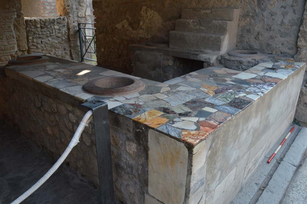 I.9.4 Pompeii. August 2021. Looking south-west across top of podium/counter. Photo courtesy of Robert Hanson.