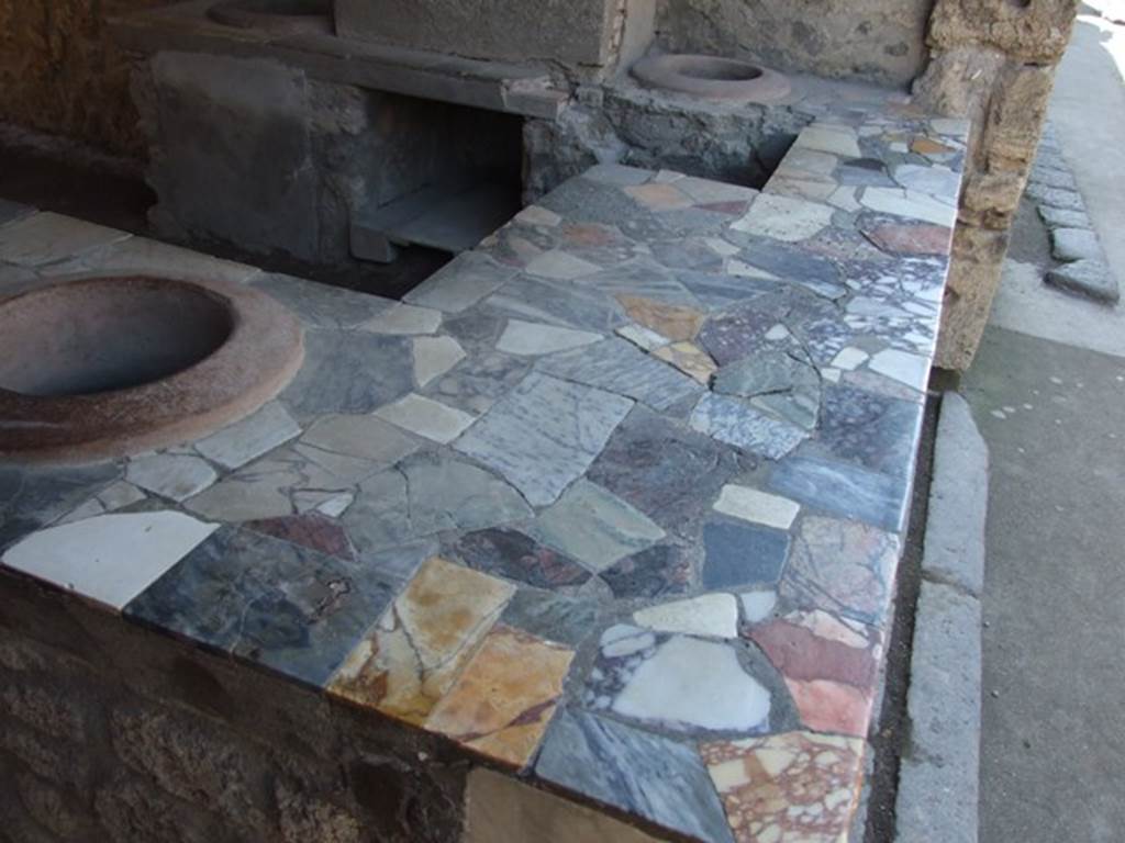 I.9.4 Pompeii. April 2013. Top of marble counter, looking west. Photo courtesy of Klaus Heese.