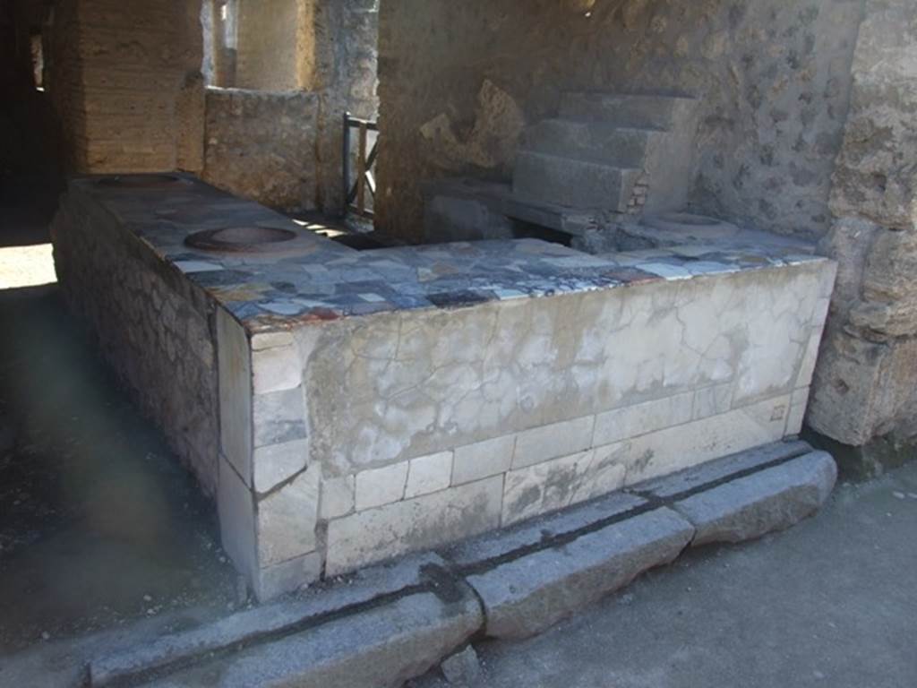 I.9.4 Pompeii. December 2018. Looking south-west across marble topped counter towards west wall. Photo courtesy of Aude Durand.

