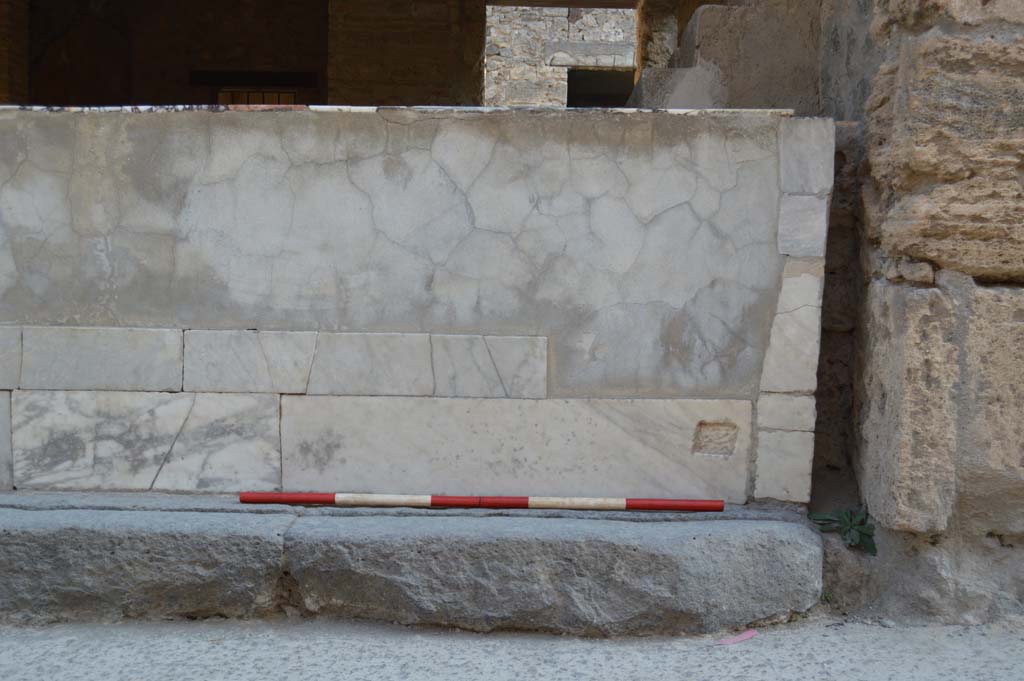 I.9.4 Pompeii.  March 2009.  Marble counter and display shelving.