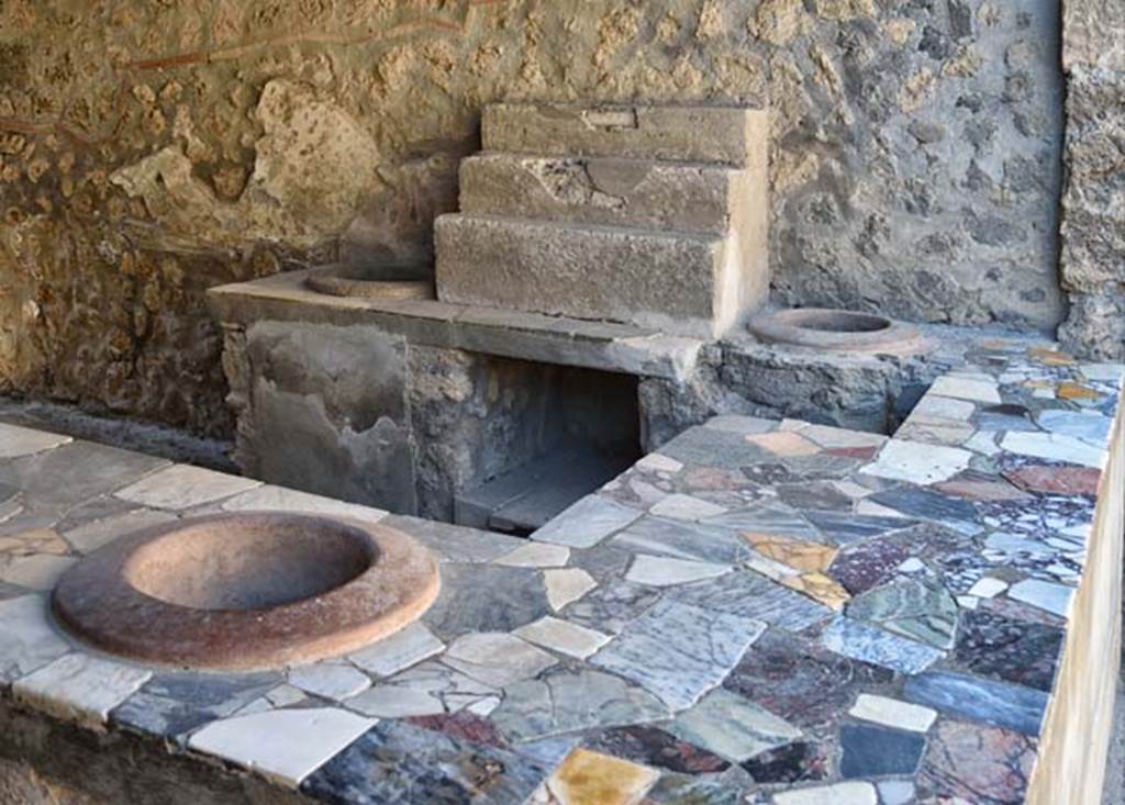 I.9.4 Pompeii. October 2001. Looking east along front of counter and entrance sill. 
Photo courtesy of Peter Woods. 
