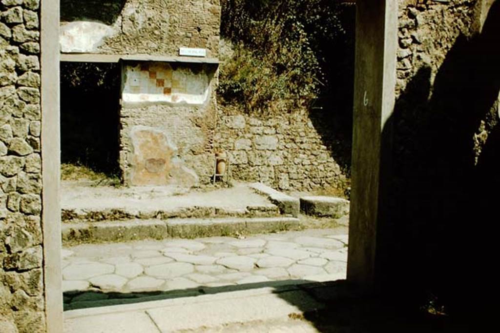 I.9.6 Pompeii. 1957. Looking north through entrance doorway, across Via dellAbbondanza towards the doorway of IX.13.6. Photo by Stanley A. Jashemski.
Source: The Wilhelmina and Stanley A. Jashemski archive in the University of Maryland Library, Special Collections (See collection page) and made available under the Creative Commons Attribution-Non Commercial License v.4. See Licence and use details.
J57f0220
