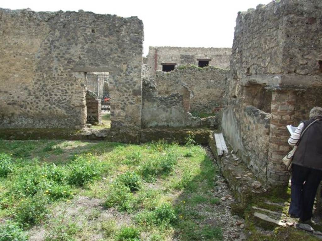 I.9.11 Pompeii.  March 2009.  Looking south across yard area 