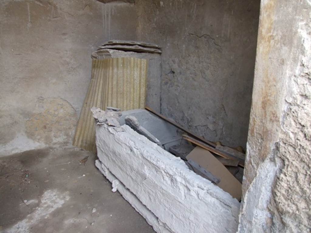 I.9.14 Pompeii. March 2009.  Room 15.  Plaster cast of furniture against west wall.